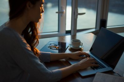 woman using laptop on desk